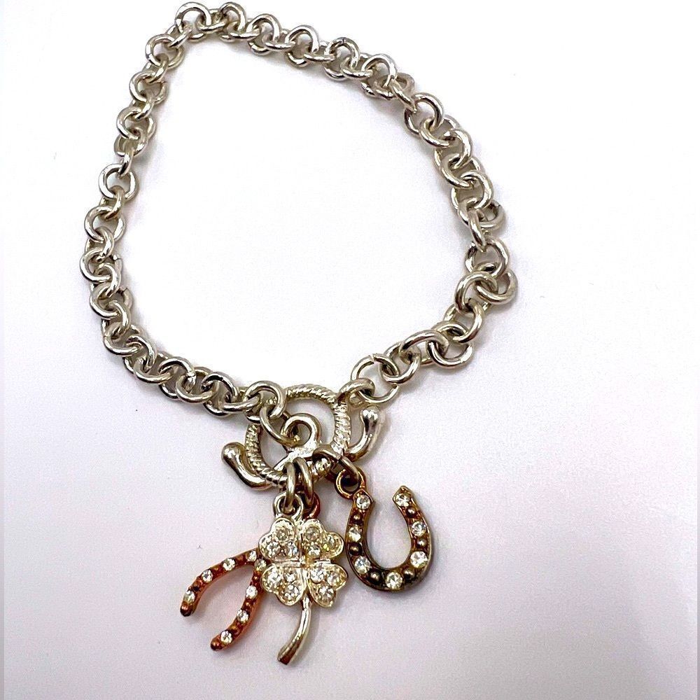*3/$20* Silver tone toggle bracelet with horseshoe clover and wishbone charms